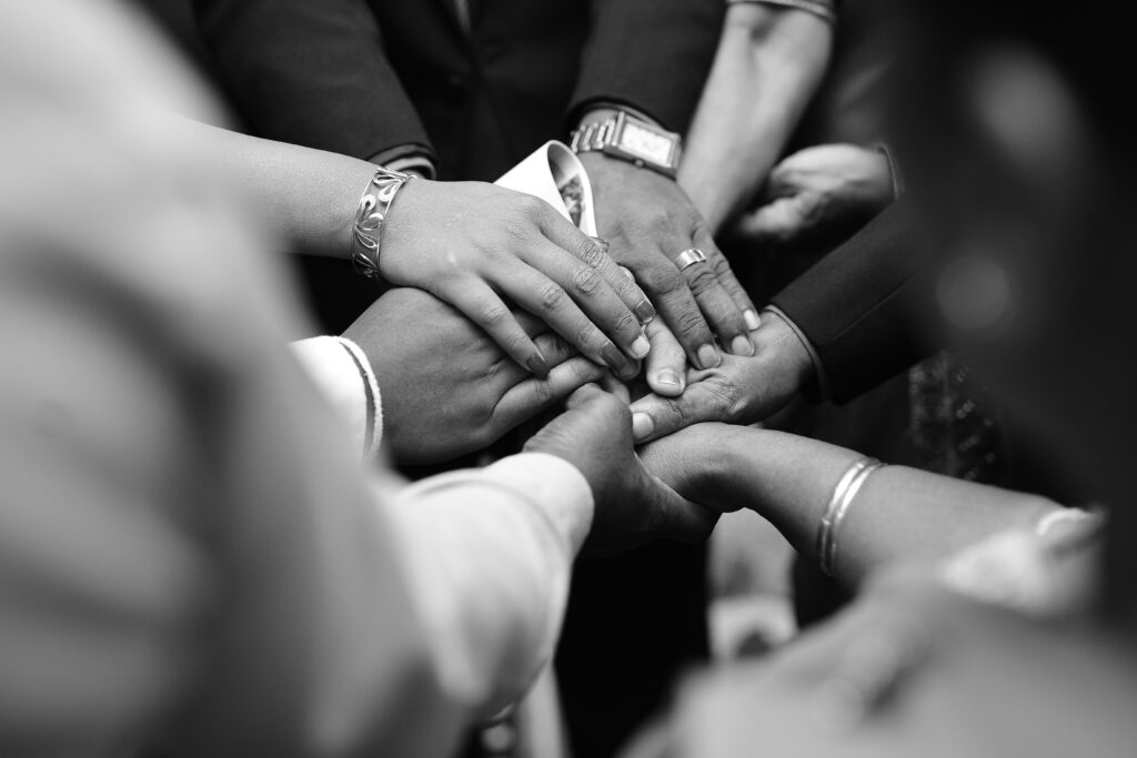 pexels photo 17010855 17010855 A close-up black and white photo of diverse hands united in prayer, symbolizing spiritual unity.